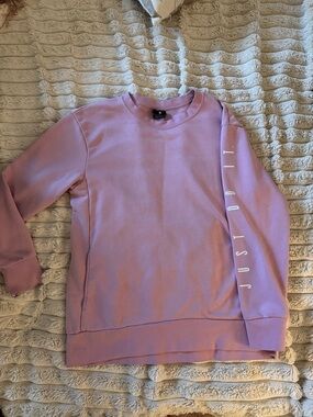 Nike Women’s Lavender Crewneck Sweatshirt with 'Just Do It' Sleeve